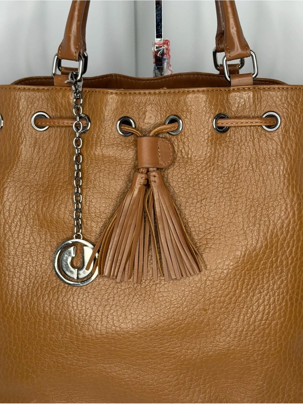 Stylish Tan Leather Satchel with Tassel Charm